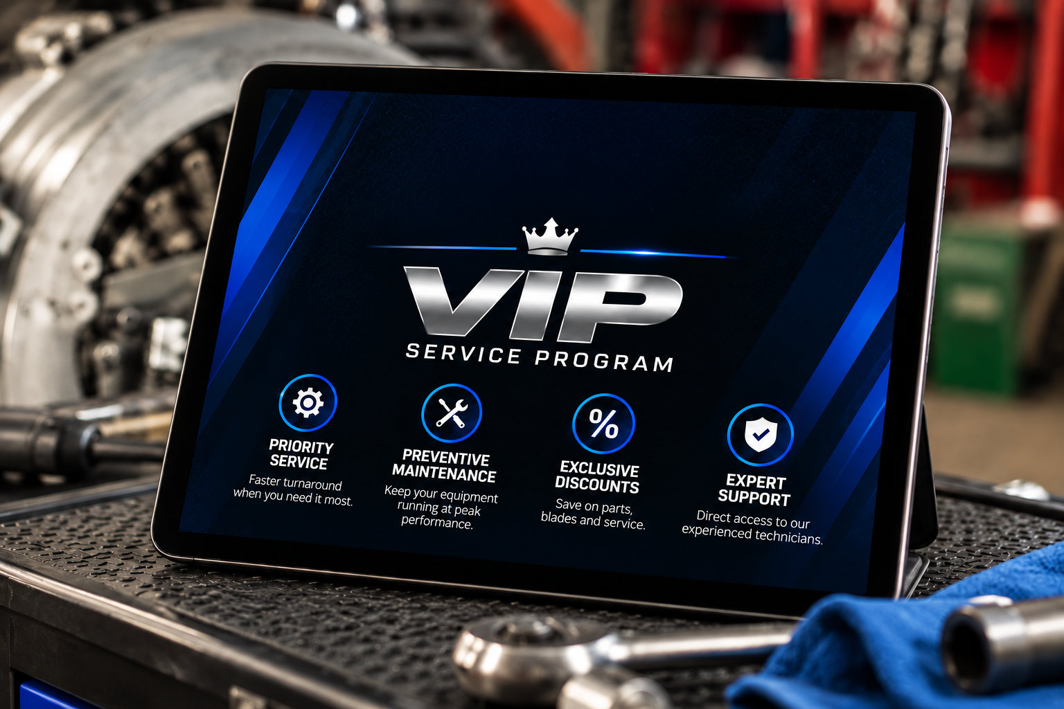 Tablet on a workshop bench showing the Blade Techs VIP Service Program with priority service, preventive maintenance, exclusive discounts and expert support